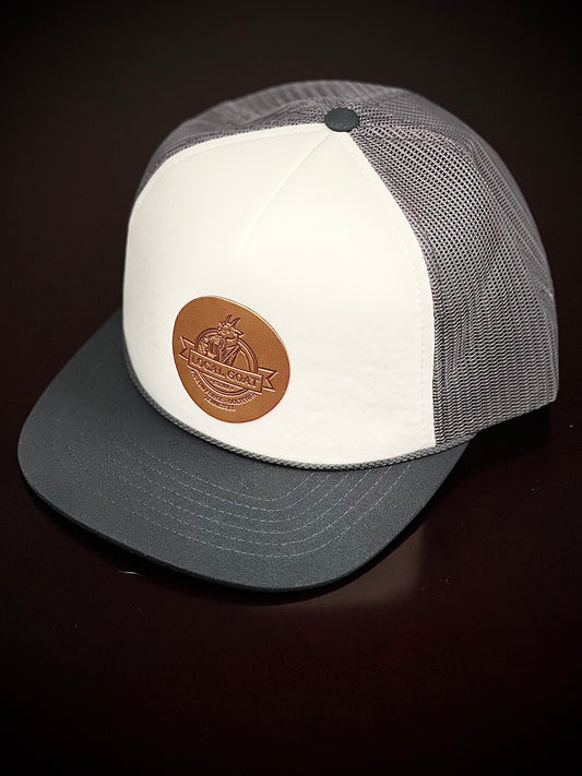 Foam mesh trucker hat with leather logo patch