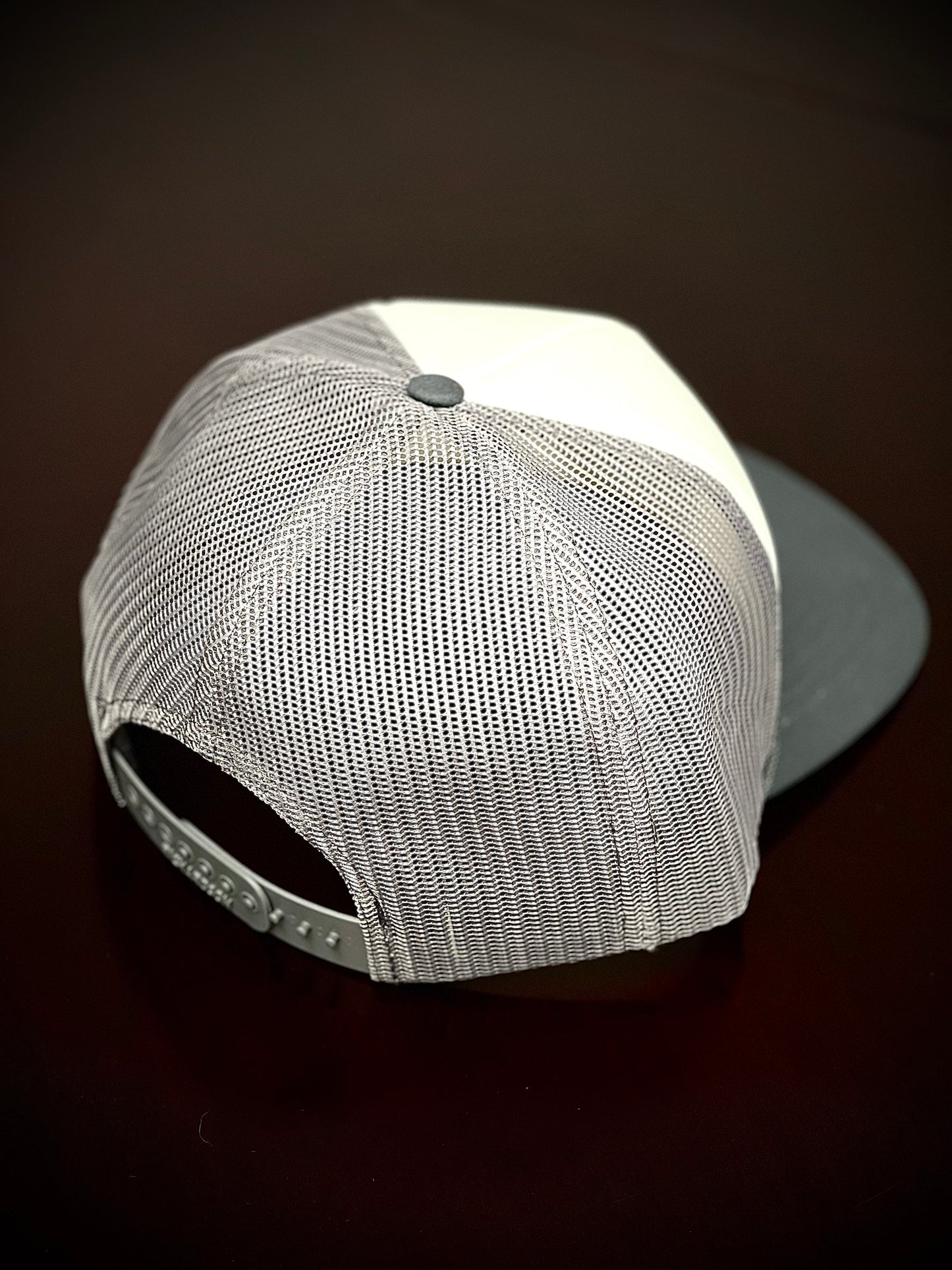 Foam mesh trucker hat with leather logo patch